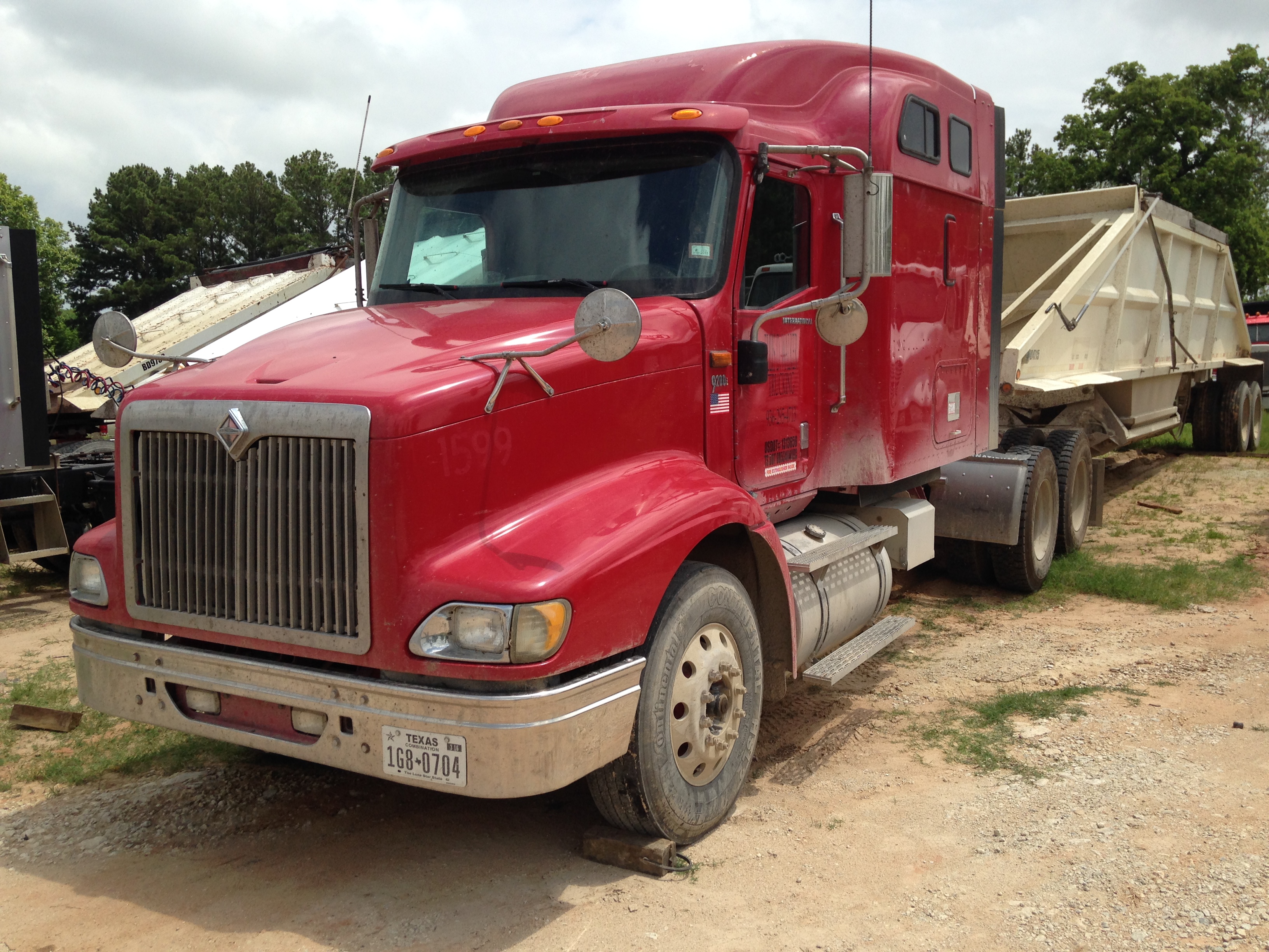 A loaded dump truck and gravel trailer ready for a Walker County delivery