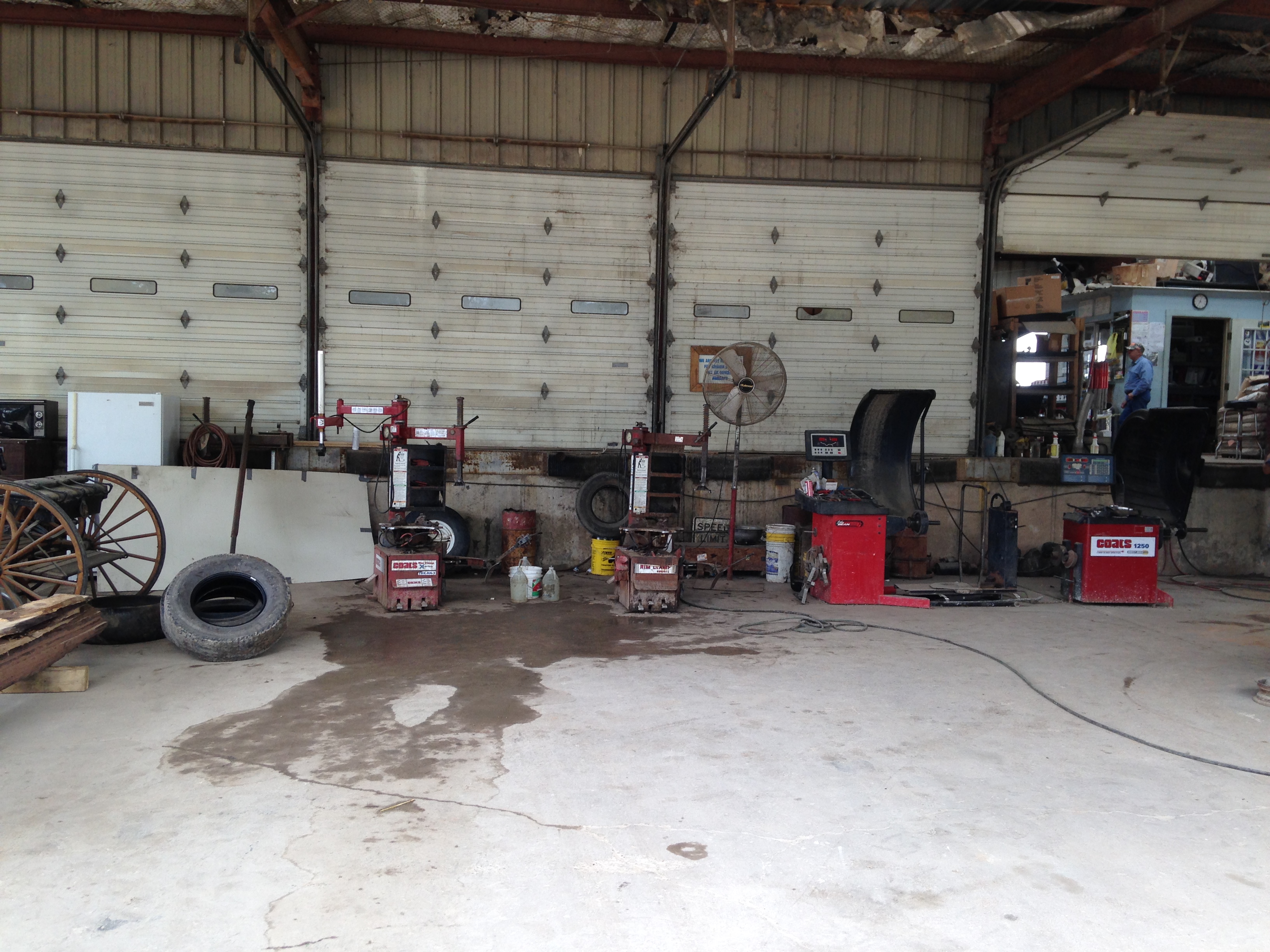 Tire changing and balancing equipment inside our shop bay in Huntsville, Texas
