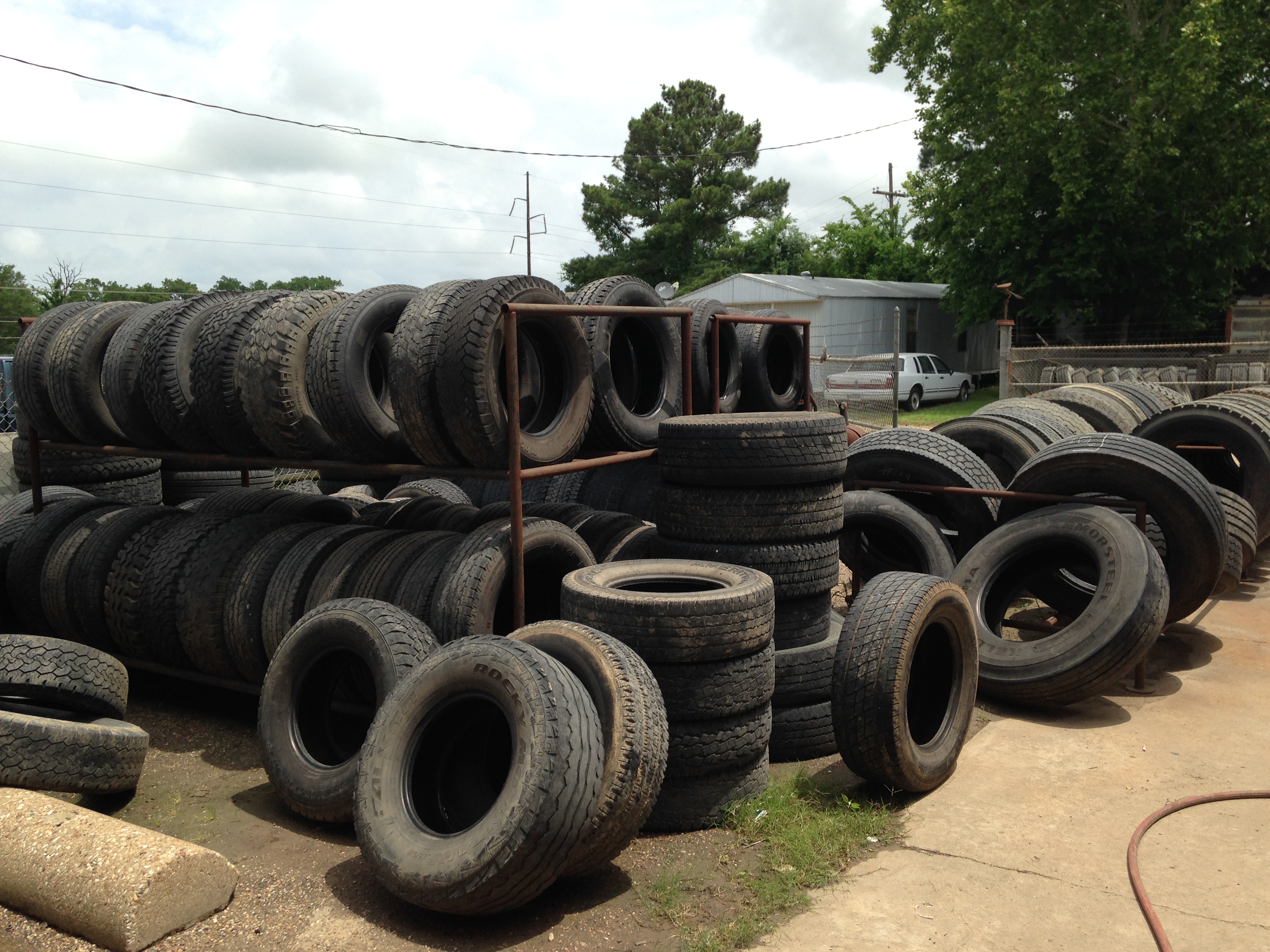 Stacks of truck and tractor tires ready for sale in our Huntsville, Texas yard
